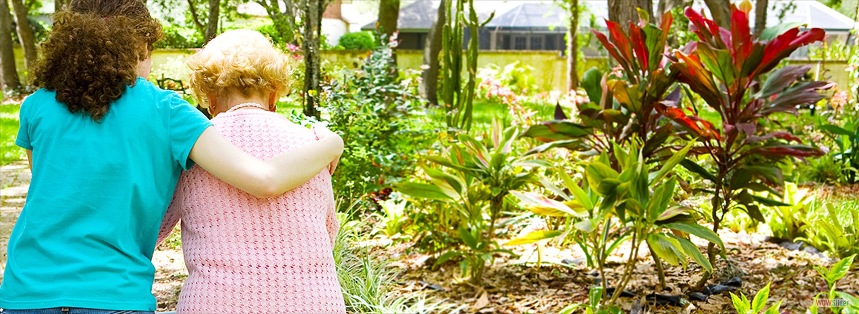 younger woman with arm around older woman